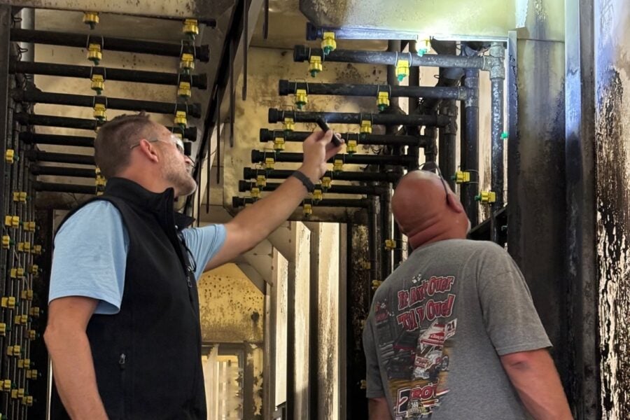 Troy Chemical pretreatment certified rep troubleshooting a surface finishing system.