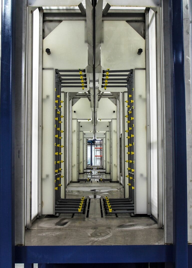 Interior of a multi-stage, recirculating, surface finishing system.
