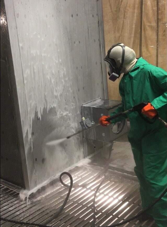 Application of pretreatment chemicals in a spray wand surface finishing process.