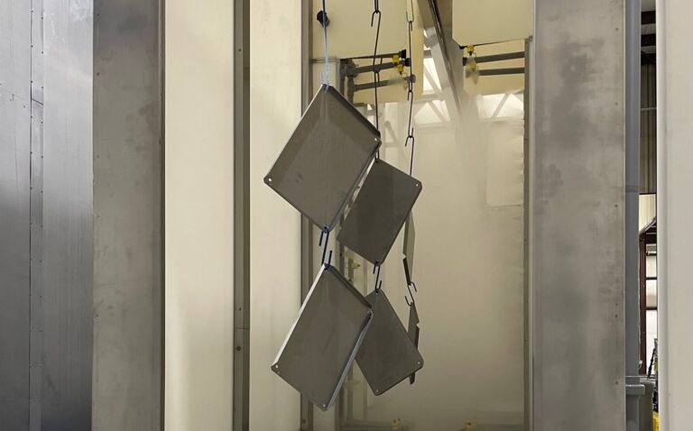Application of an alkaline cleaner in a surface finishing system.
